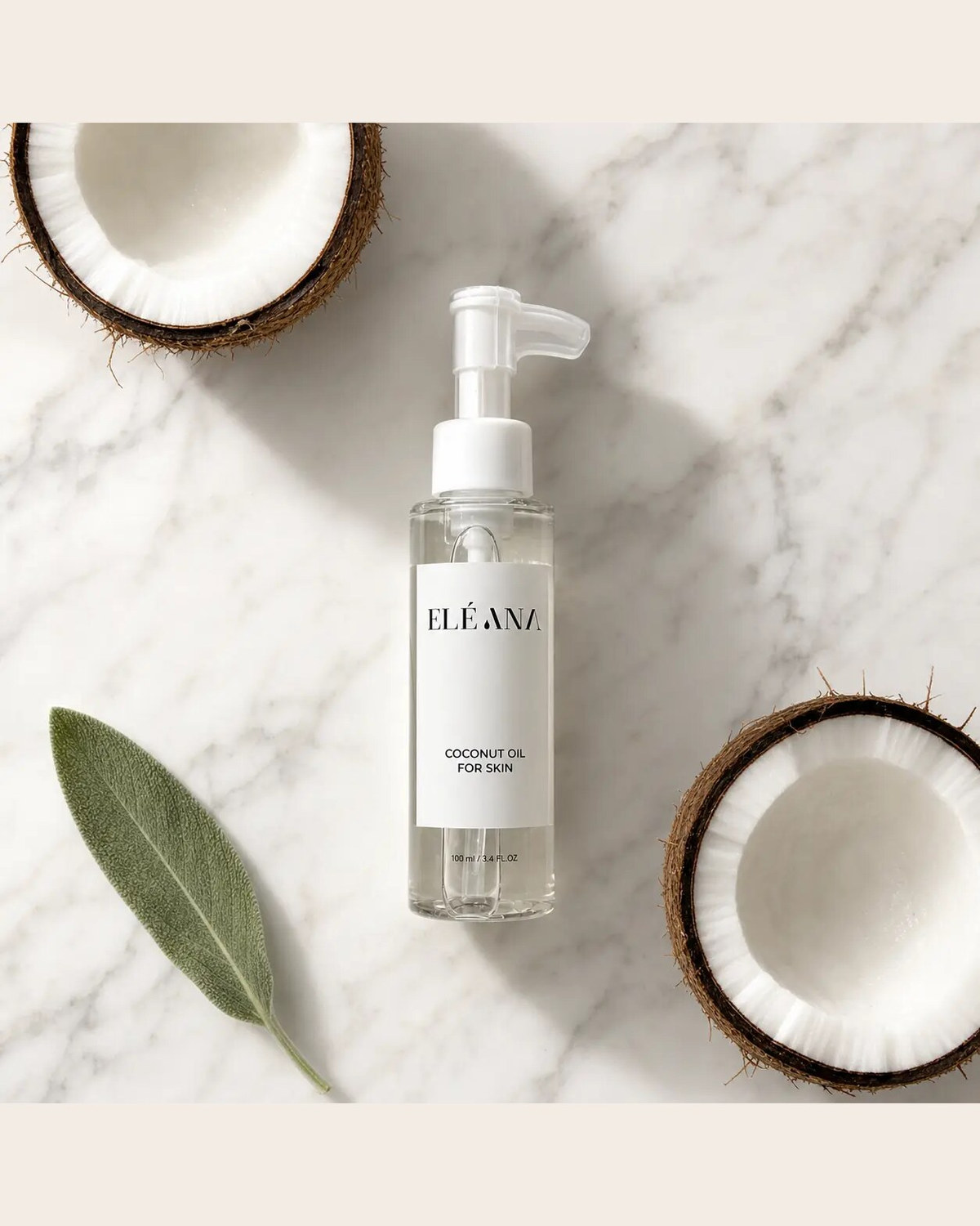ELÉANA Coconut Oil for Skin bottle on a marble surface